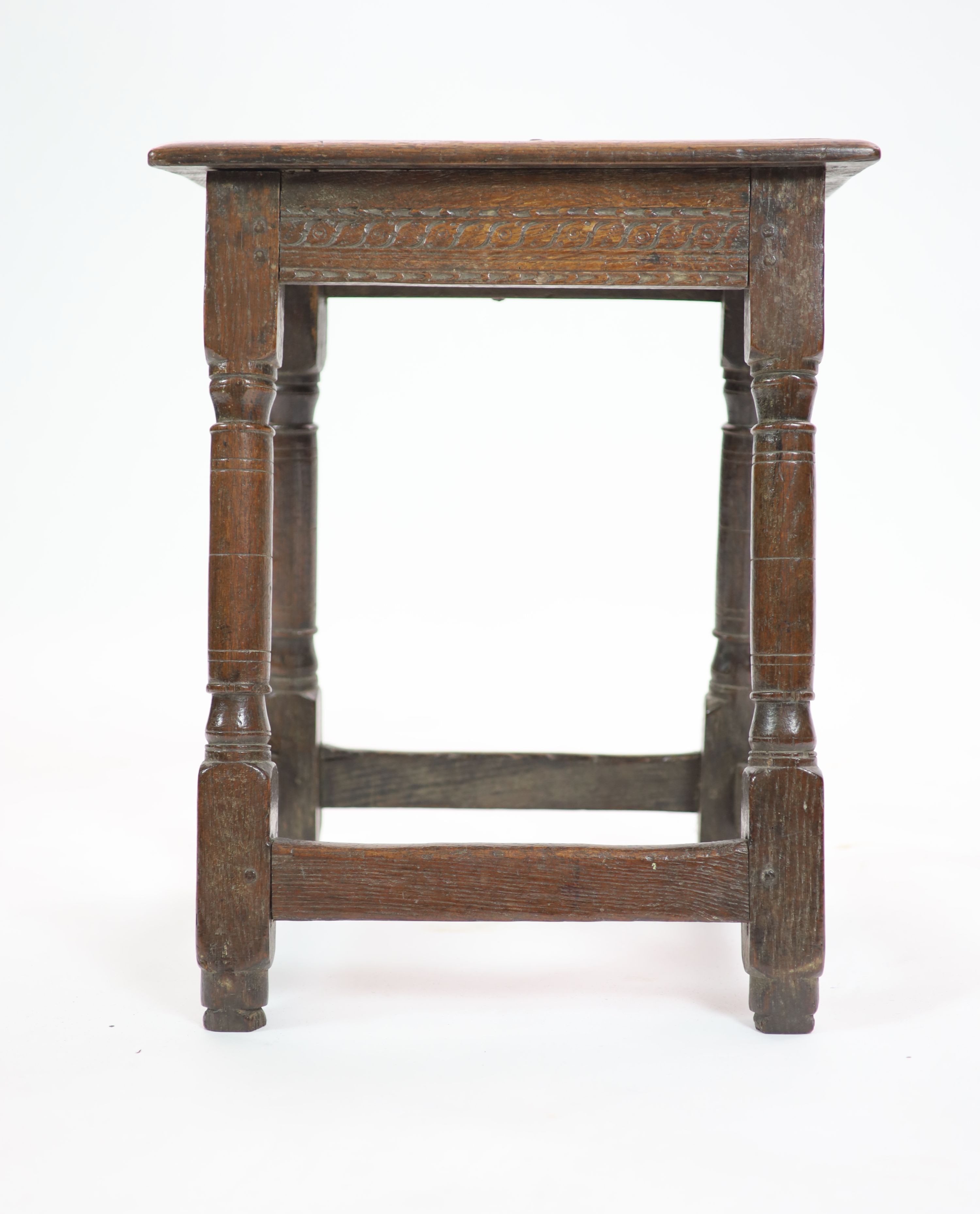 A mid-17th century oak joint stool H 58cm. W 48cm. D 30cm.